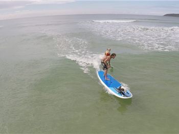 'Top dog' Chris De Aboitiz's new dog SUP surfing trick - Stand Up Paddle News